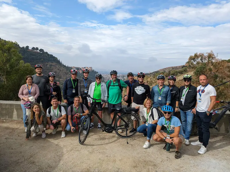 Group of cyclists at Sacromonte Abbey during Granada eBike tour